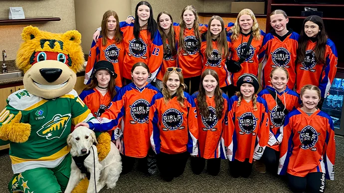 Photo of hockey players with Nordy at MN Wild Suite Night