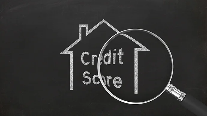 Magnifying glass over a chalk outline of a house with "Credit Score" written inside.