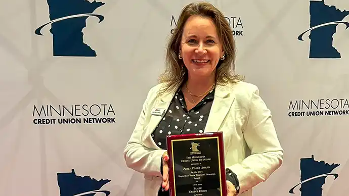 Blaze Receives MN Credit Union Network Honor for Youth Financial Education Christine Cordell holding the 2025 Desjardins Youth Financial Education award