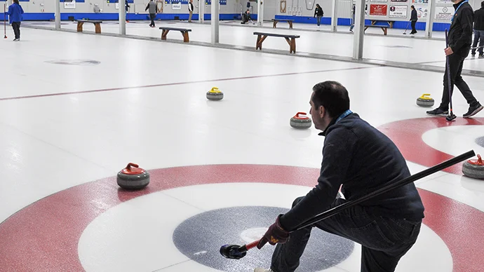 Hiway employee enjoying curling