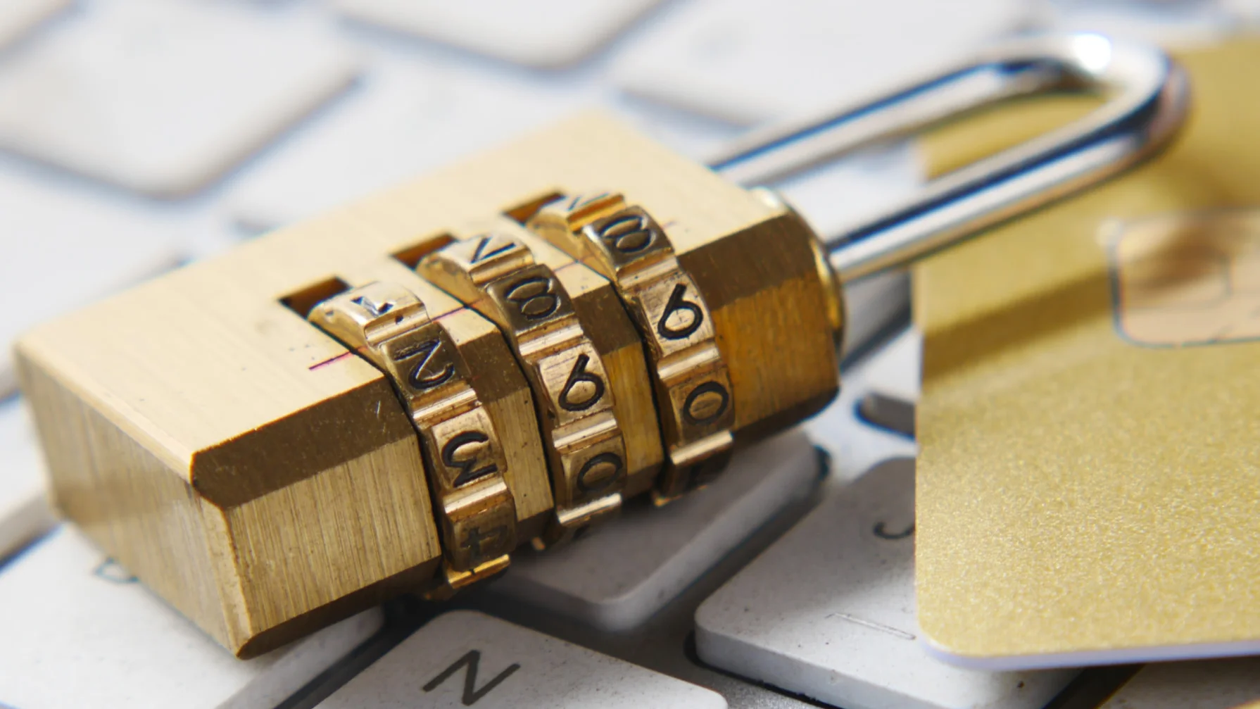 Combination padlock sitting on a keyboard